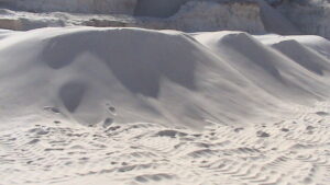 Silica sand quarry operations with loader and trucks in Egypt